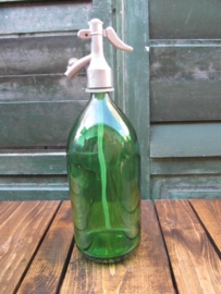 Old seltzer soda bottle in green