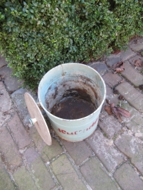 Old green bin with lid