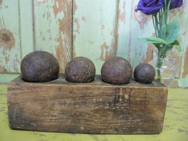 Antique bal shape weights on wooden stand