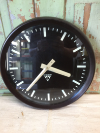 Old industrial clock, bakelite edge black dial