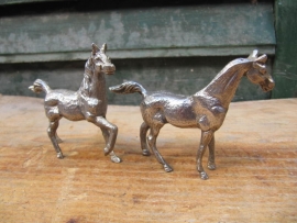 Two (silvered) horses