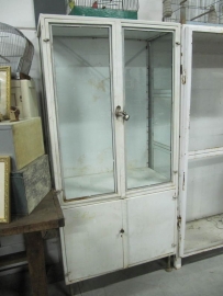 Pharmacists metal cabinet with glass shelves