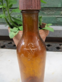 French old brown medicine bottle of E & J Gravis 155ml.