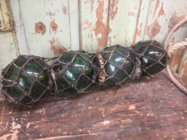 Antique French glass floats in net