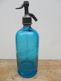 Bright blue seltzer soda bottle with print
