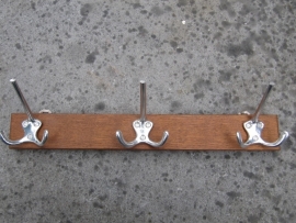 Coat rack with 3 hooks.