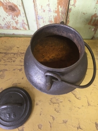 Very old cast iron small pot with 3 legs and lid