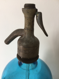 Antieke blauwe spuitfles