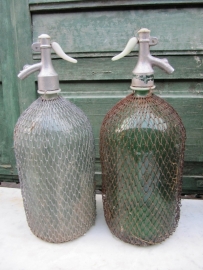 Beautiful green spray bottle of 2 liters with gauze