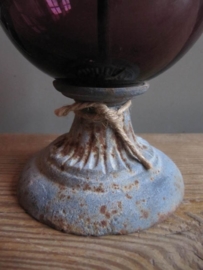 Purple glass globe on foot