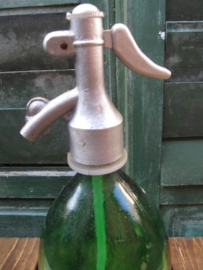 Old seltzer soda bottle in green