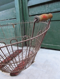 Brocante metal basket with two wooden handles.