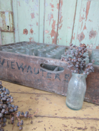 Large antique crate with bottles
