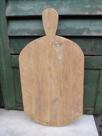 Cute long cutting board with rounded corners.