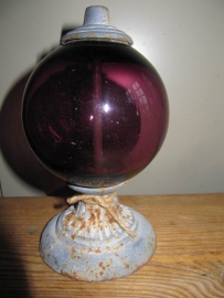 Purple glass globe on foot