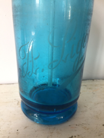 Antieke blauwe spuitfles
