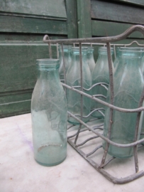 Old metal crate with 1/2 liter milkbottles