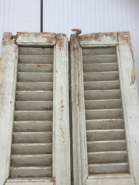 Antique double louvered doors set with espagnolette closure.