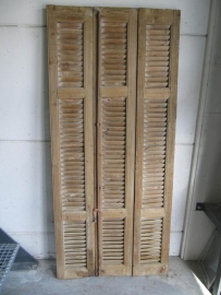 Antique louvered door into 3 sections with espanjolet closure