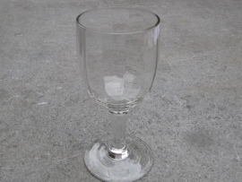 Wine glass with polished facet.