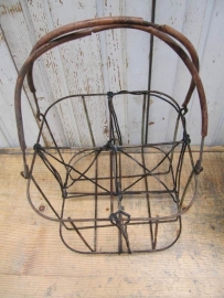 Antique basket for carrying 4 bottles.