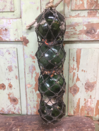 Antique French glass floats in net