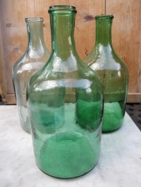 Ancient brocante green bottle with narrow neck.