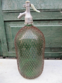 Beautiful green spray bottle of 2 liters with gauze