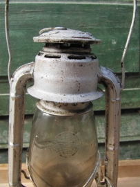 Old oil lamp white / brown / reddish.