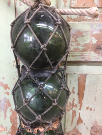 Antique French glass floats in net