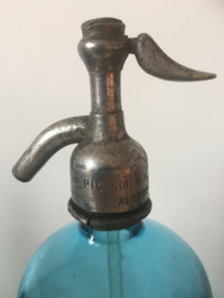 Oude spuitfles met opschrift