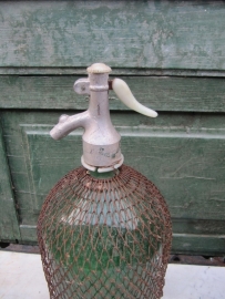 Beautiful green spray bottle of 2 liters with gauze