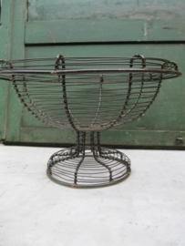 Ancient brocante eggbasket on foot