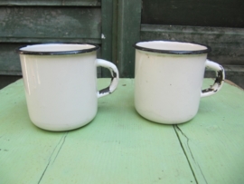 White enamel cup with black border