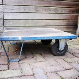 Old pallet coffee table on wheels