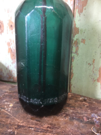 Old seltzer bottle, facet, dark green