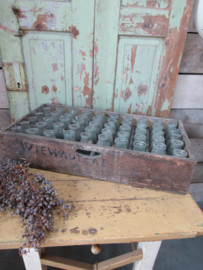 Large antique crate with bottles