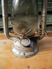 Old oil lamp white / brown / reddish.