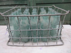 Old metal crate with 1/2 liter milkbottles
