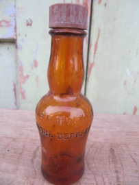 Brown medicine bottle with dial cap