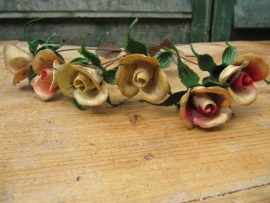 Old plastic flowers on metal, six