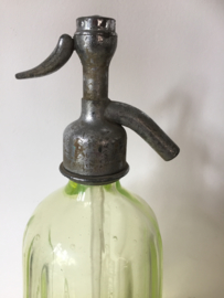Antieke spuitfles met opdruk