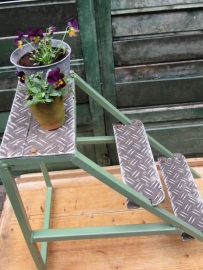 Old industrial metal ladder or stool