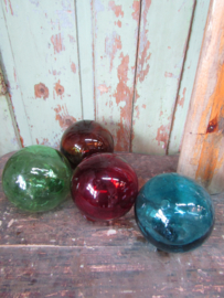 Oude glazen drijver rood
