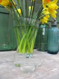 Old brocante tealight holder from glass on 3 feet