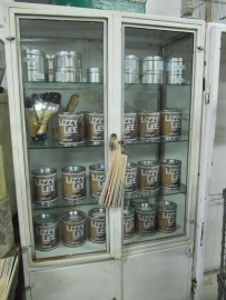 Pharmacists metal cabinet with glass shelves