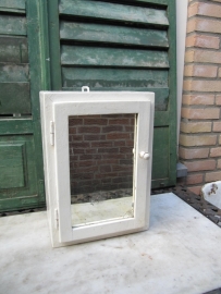 Beautiful old white medicine cabinet with mirror