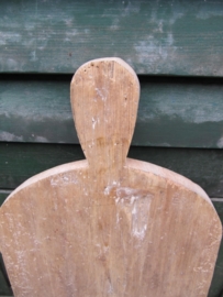 Cute long cutting board with rounded corners.
