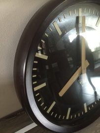 Old industrial clock, bakelite edge black dial