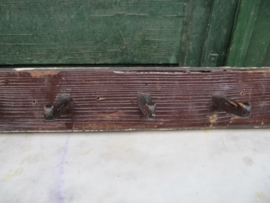 Brocante wooden coat rack with seven wooden hooks.